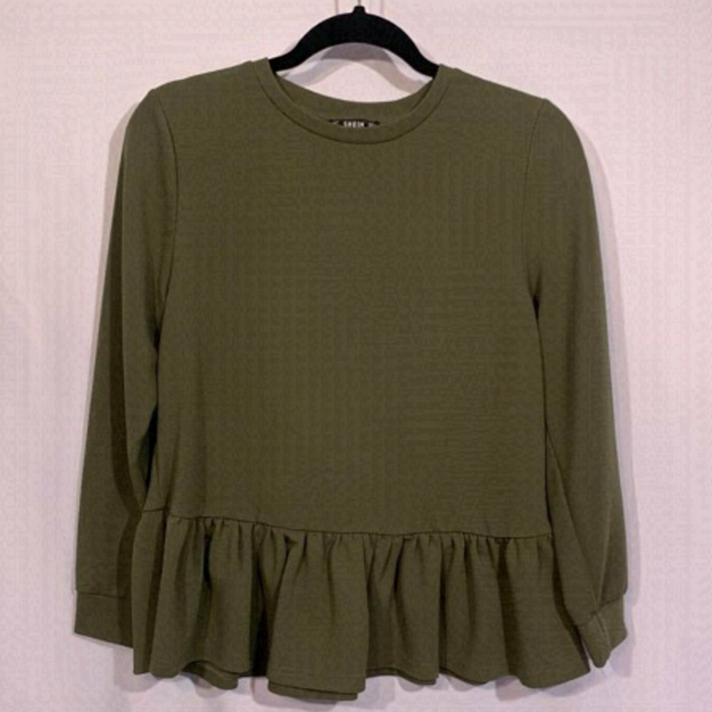 WOMAN’S ruffle hem top. Poly/spandex blend. Army green. Crew neck. Size large.